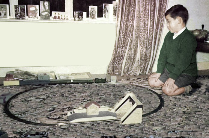 aka alt-text-restore-colour-to-faded-photos-1961-photo-of-boy-with-train-set-restored-color to faded photo-for-pricing-restoration
