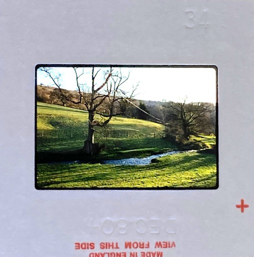 1980s slide of a country scene with mild deterioration of detail – original image ready for professional slide restoration