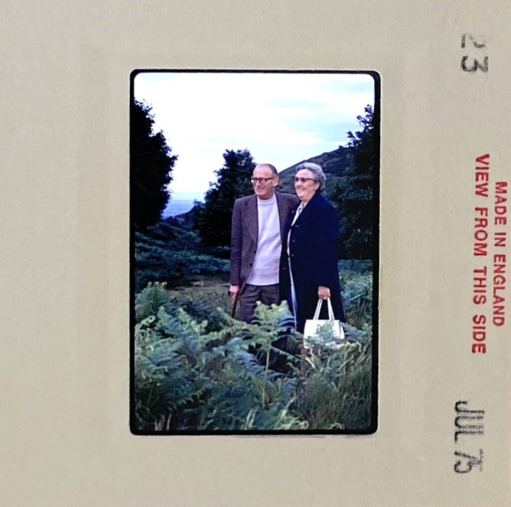 1975 slide of a couple standing in a country setting with some lost shadow detail – original image ready for professional slide restoration