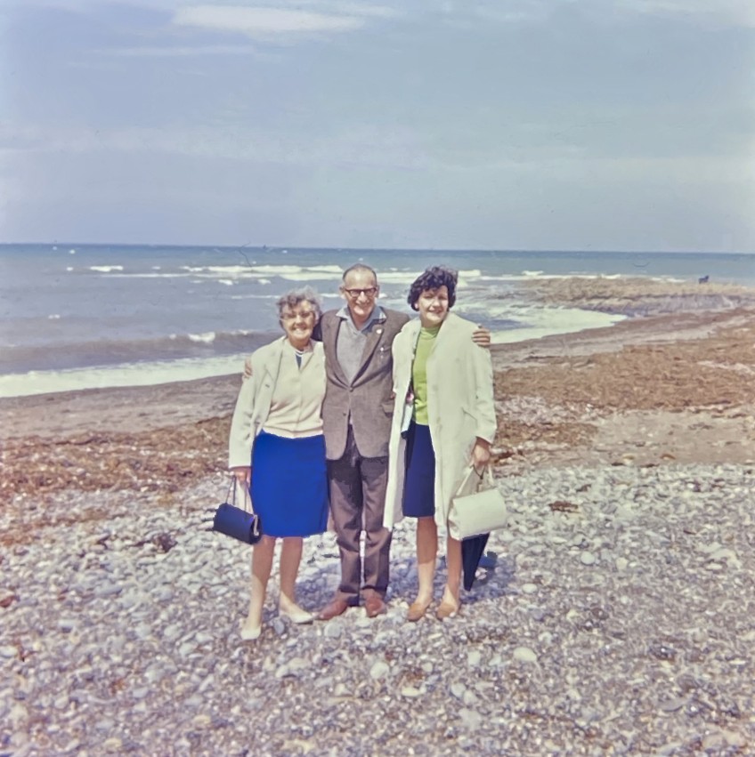fully restored and colour‑corrected 120 slide (2¼‑inch square) of a group of adults on a pebble beach, enhanced to print‑quality – professionally digitised and restored by Perth slide specialist